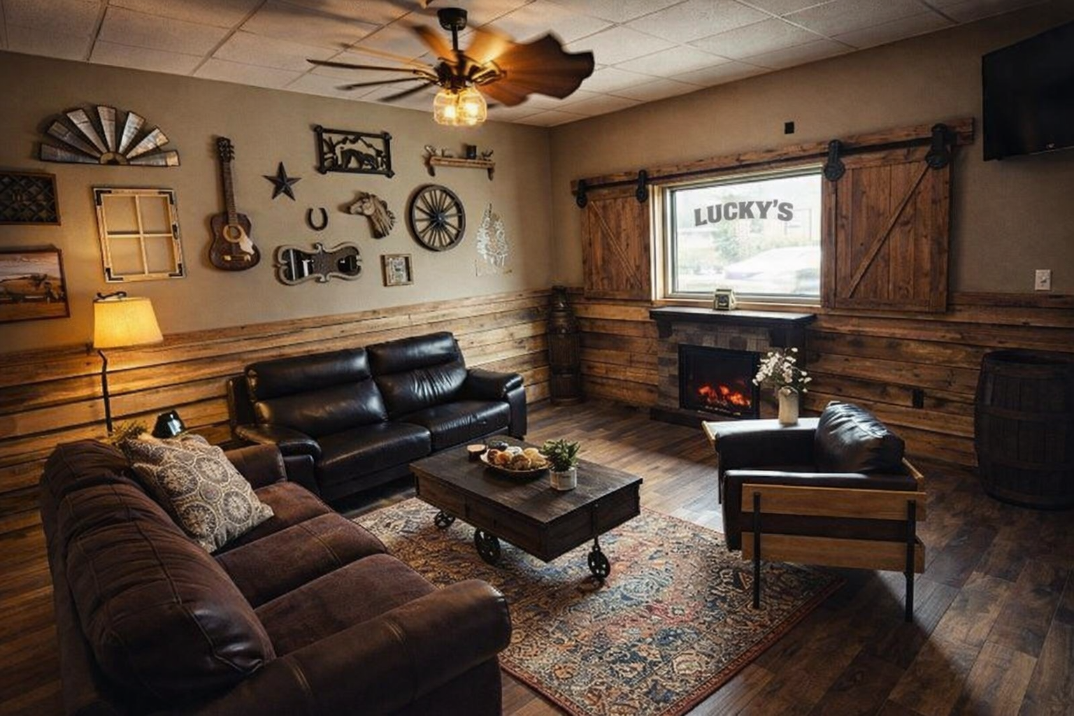 Lucky's lounge seating area with couches, coffee table, and fireplace